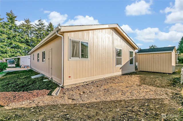 view of home's exterior featuring a storage unit