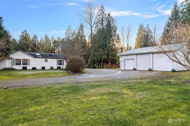 exterior space with a garage and an outdoor structure