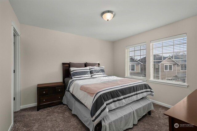 bedroom with dark carpet