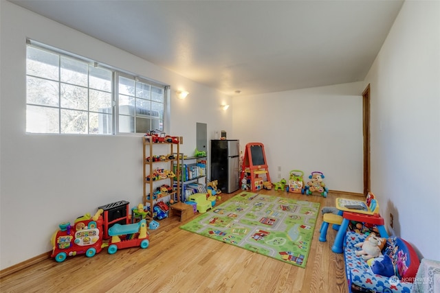 playroom with hardwood / wood-style floors