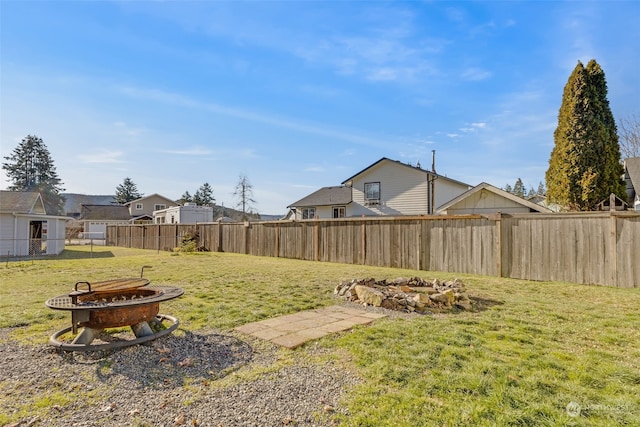 view of yard with an outdoor fire pit