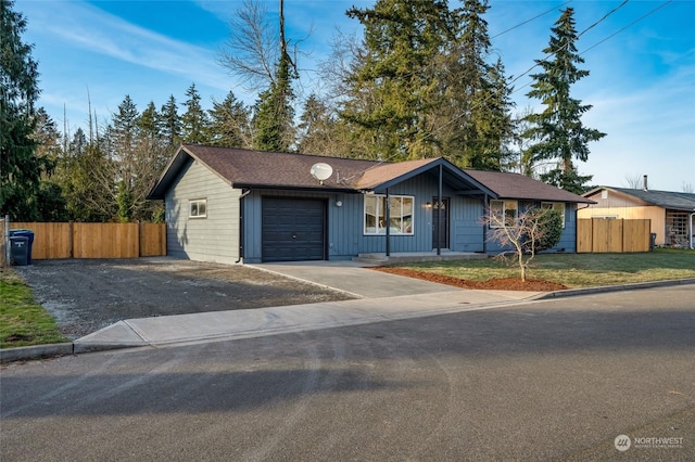 ranch-style home featuring a front yard and a garage