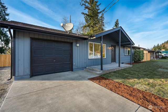 ranch-style home featuring a garage and a front yard