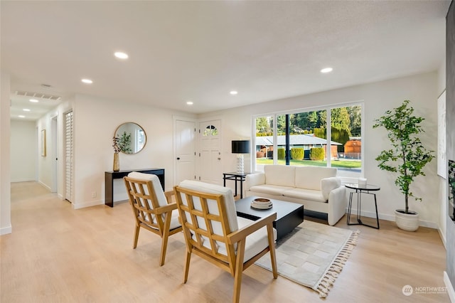 living room with light hardwood / wood-style flooring