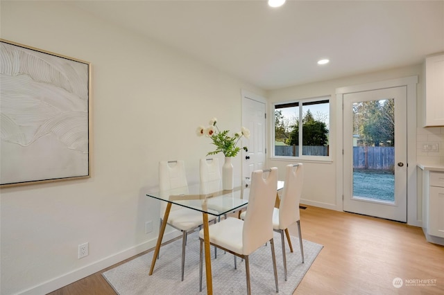 dining area with light hardwood / wood-style floors