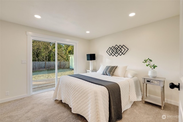 bedroom featuring light colored carpet and access to outside