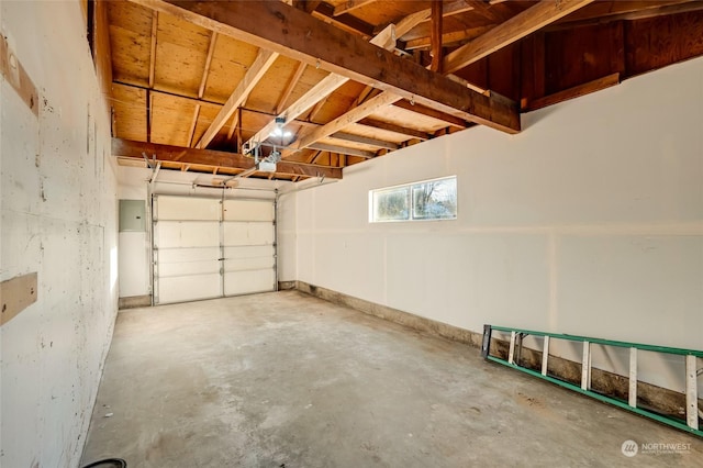 garage with electric panel and a garage door opener