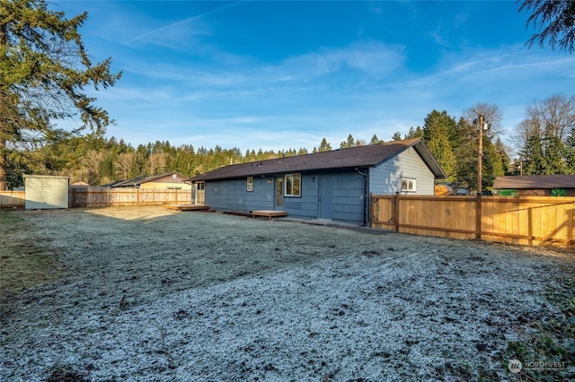 rear view of property with a lawn