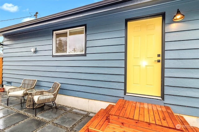 entrance to property featuring a patio