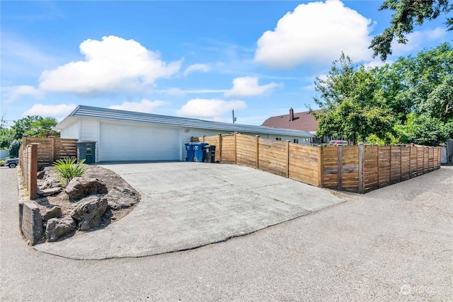 view of side of property featuring a garage