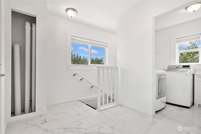 laundry room with independent washer and dryer