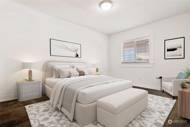 bedroom featuring dark hardwood / wood-style flooring