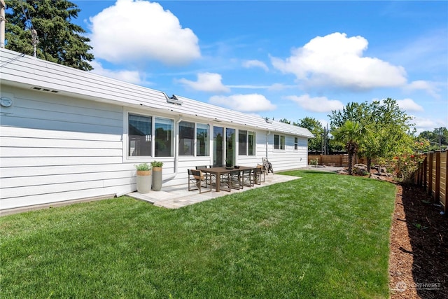 exterior space featuring a yard and a patio area