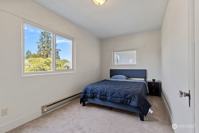 bedroom featuring a baseboard radiator and carpet