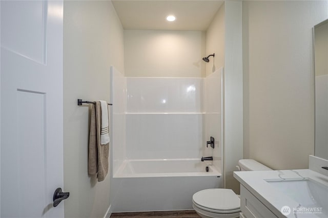 full bath featuring toilet, shower / bathtub combination, and vanity