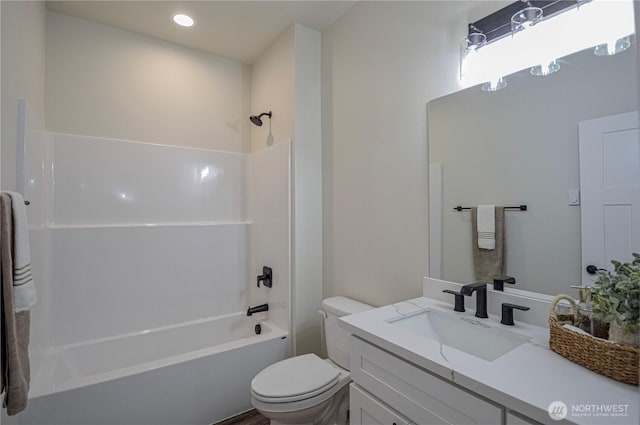 full bath featuring recessed lighting, bathtub / shower combination, vanity, and toilet