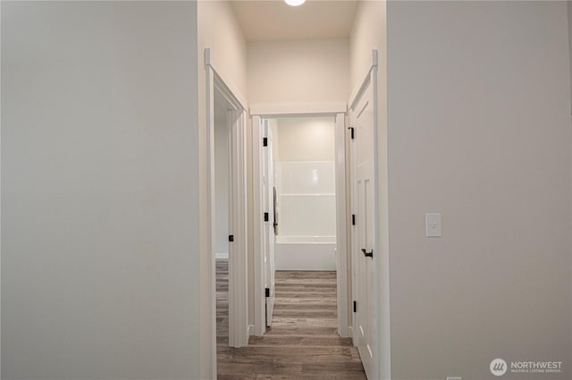 corridor featuring wood finished floors