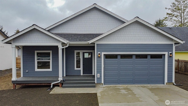 single story home with an attached garage, concrete driveway, and roof with shingles