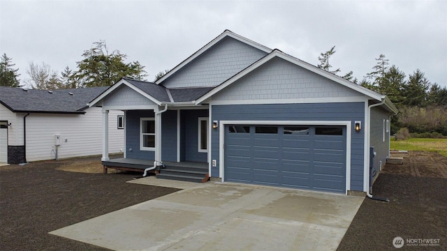 ranch-style house with a garage and concrete driveway