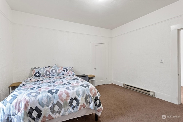 carpeted bedroom with a baseboard heating unit