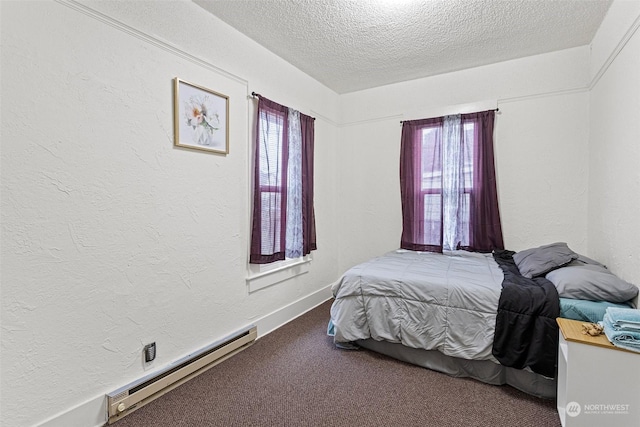 bedroom featuring a textured ceiling, a baseboard radiator, carpet floors, and multiple windows