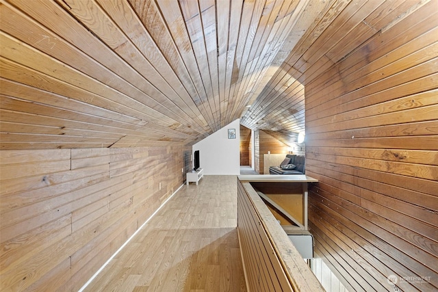 bonus room featuring wood walls, vaulted ceiling, and wood ceiling