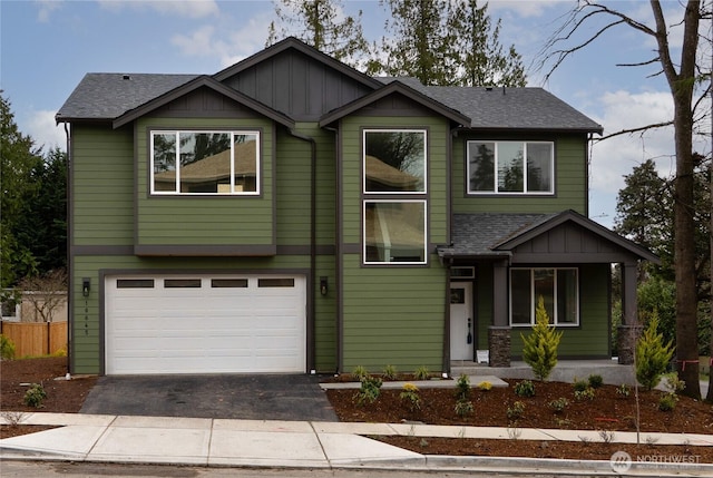 17018 106th Ave SE Unit 11, Renton, WA 98055 - view of front of home featuring driveway, a garage, a porch, board and batten siding, and roof with shingles