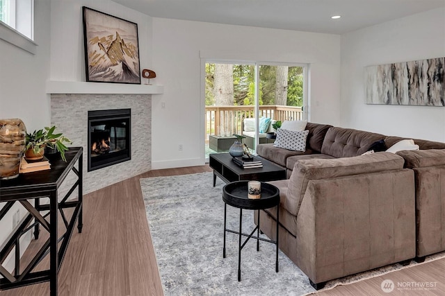 17018 106th Ave SE Unit 11, Renton, WA 98055 - living room with a glass covered fireplace, wood finished floors, and recessed lighting
