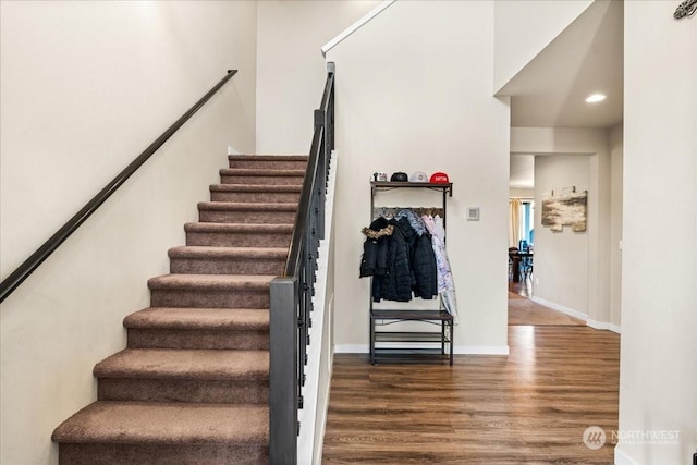 stairway with hardwood / wood-style floors