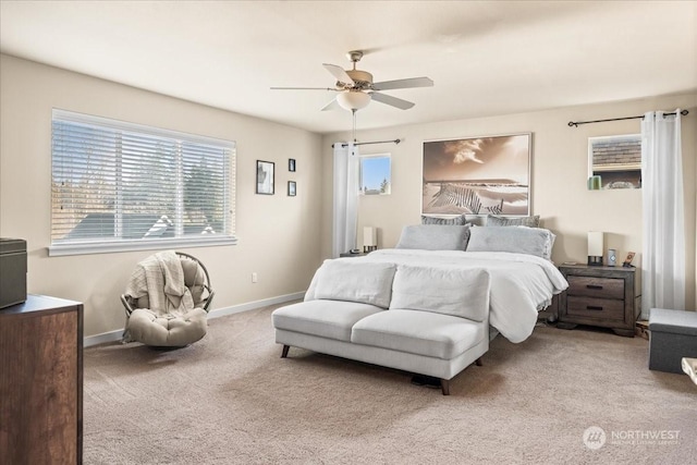 bedroom featuring ceiling fan and light carpet