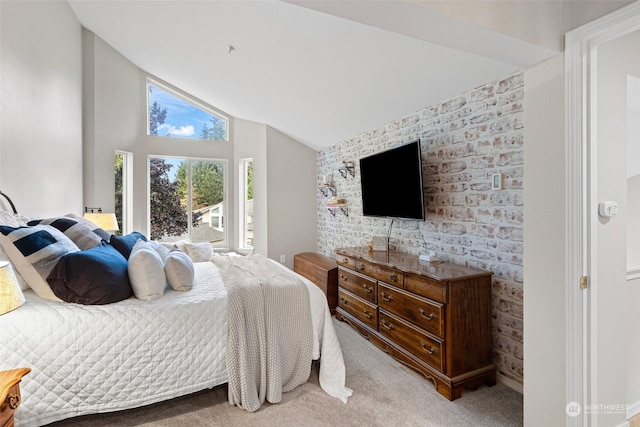 bedroom featuring light colored carpet and lofted ceiling