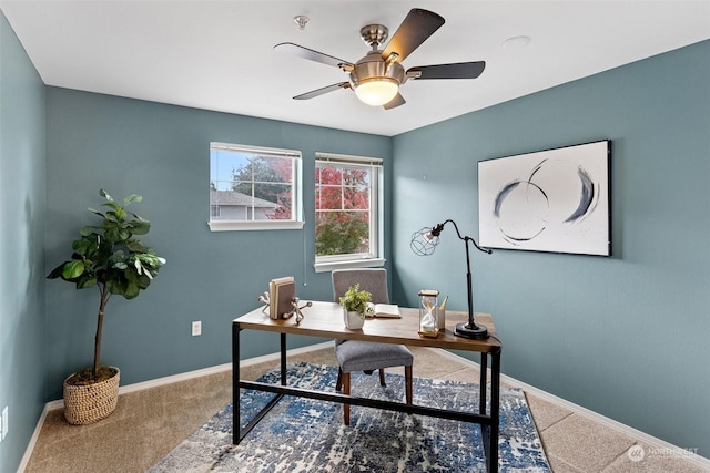 home office featuring carpet flooring and ceiling fan