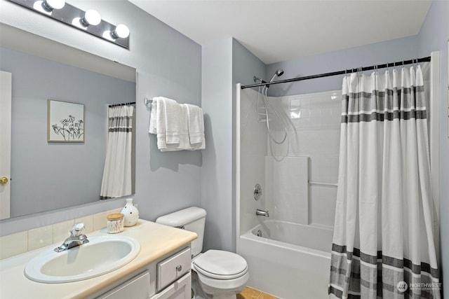 full bathroom with vanity, toilet, and shower / bath combo with shower curtain