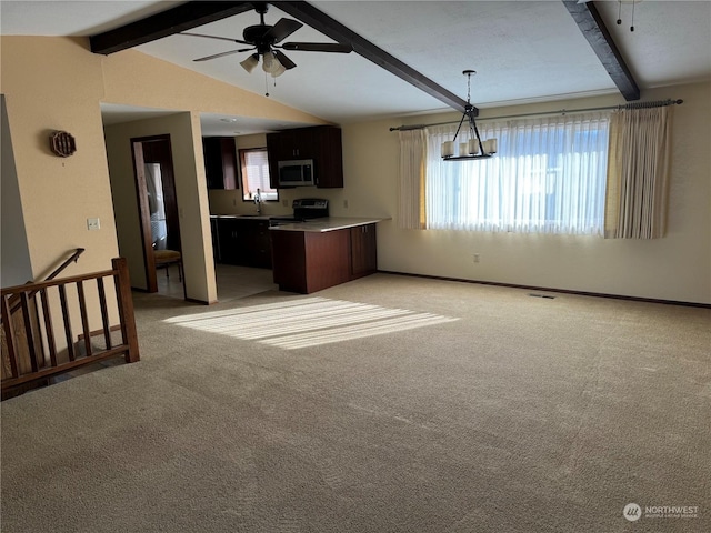 kitchen with dark brown cabinetry, sink, lofted ceiling with beams, light carpet, and ceiling fan