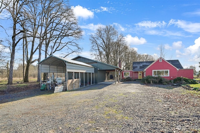 exterior space with a carport