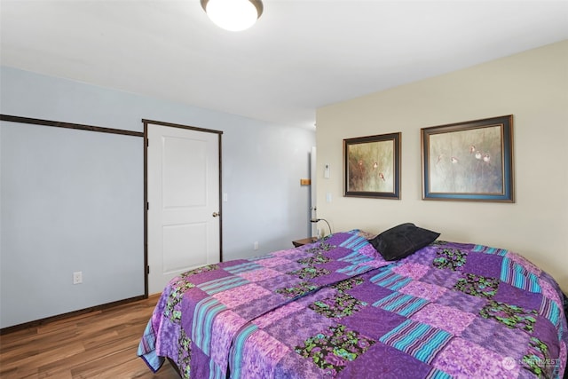 bedroom featuring wood-type flooring