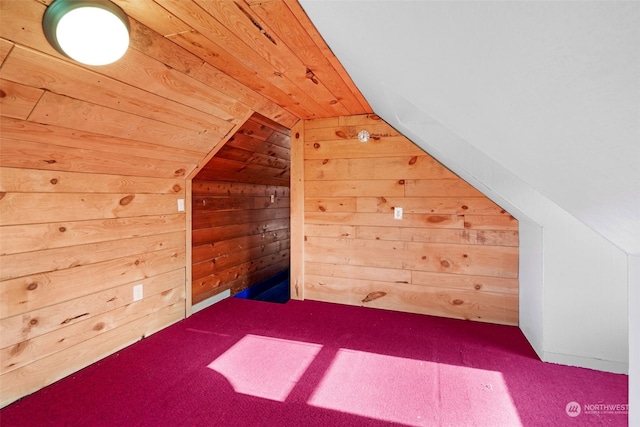 bonus room with wood ceiling, vaulted ceiling, carpet, and wood walls