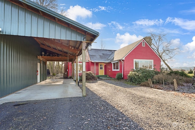 view of property exterior with a carport