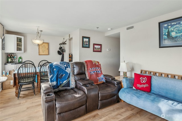 living room with light hardwood / wood-style floors