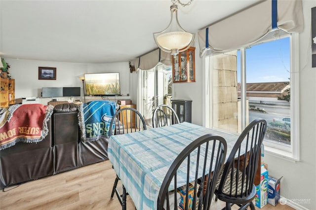 dining space with light wood-type flooring