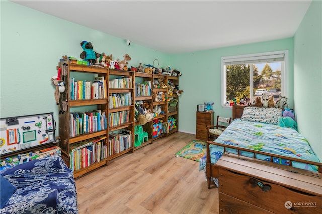 bedroom with light wood-type flooring