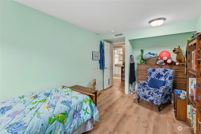 bedroom with light wood-type flooring