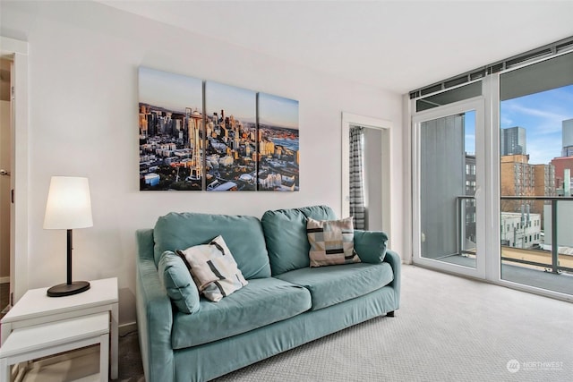 carpeted living room featuring a wall of windows