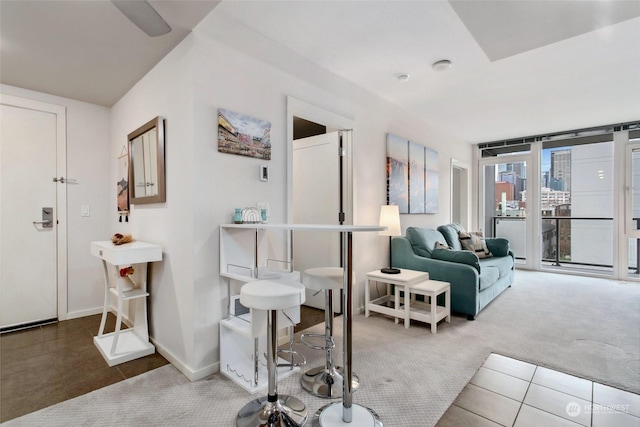 living room with tile patterned floors