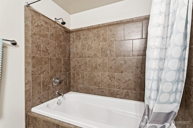 bathroom with shower / tub combo with curtain