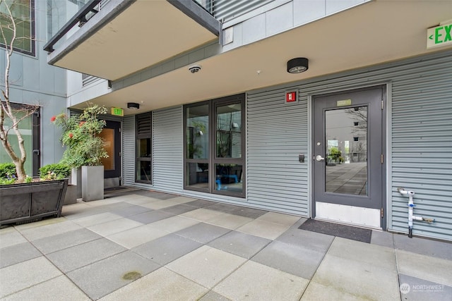 property entrance featuring a patio