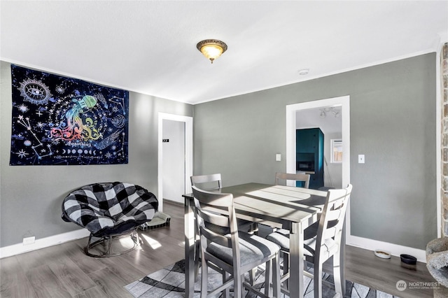 dining area with hardwood / wood-style flooring