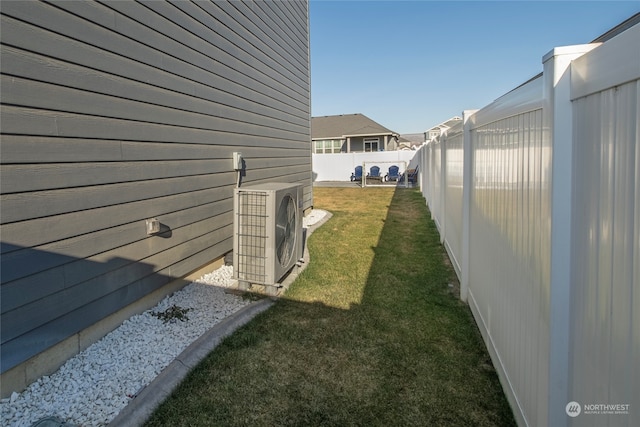 view of property exterior featuring ac unit and a yard