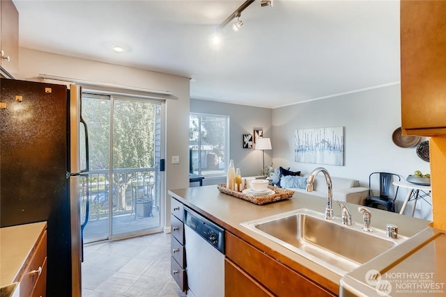 kitchen with sink, stainless steel appliances, and rail lighting