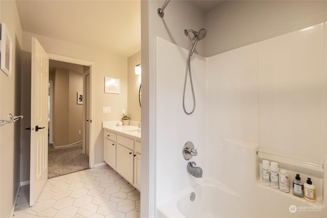 bathroom with shower / tub combination, vanity, and tile patterned flooring